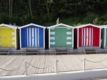 Multicoloured beach huts in Colwell
