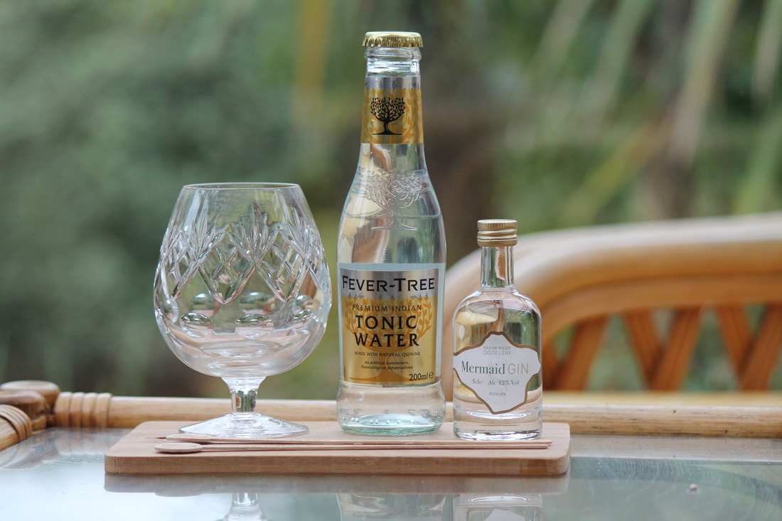 Mermaid gin with bottle of tonic water