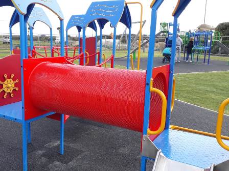 Red playground equipment at Sandham Gardens