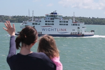 Person waving at Wightlink ferry 