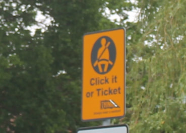 Click it or ticket road sign