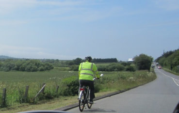 Cyclist in hi-vis jacket on the Isle of Wight