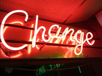 Neon change sign at an amusement arcade