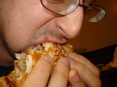 Man eating a burger king burger
