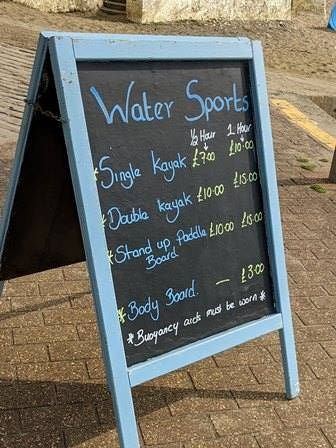 Board showing Shanklin watersports prices