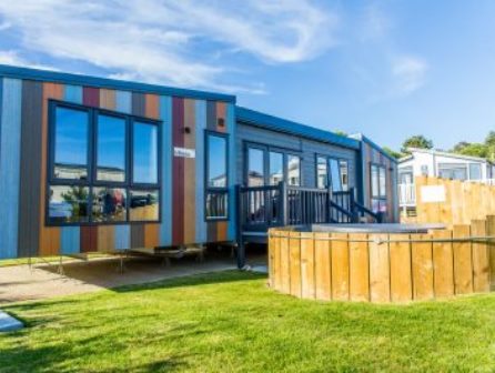 Tribeca lodge with hot tub at Whitecliff Bay Holiday Park