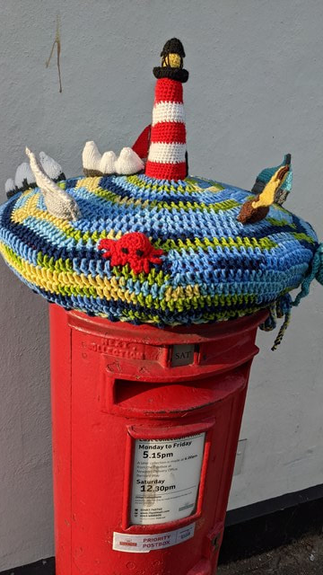 Needles yarn bomb outside carisbrooke co-op