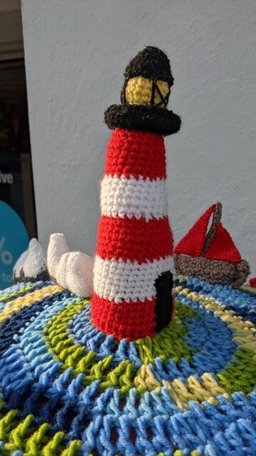 Close up on the yarn bomb of the needles